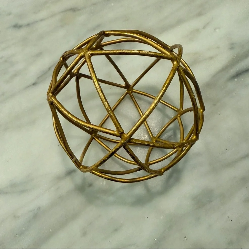 Gold round sculpture